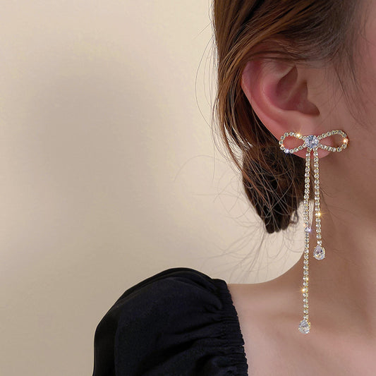 Silver bow-tie gem earrings